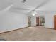 Large bedroom with neutral carpet, bright windows, a closet, and a ceiling fan at 25 Ridgeview Dr, Jonesboro, GA 30236