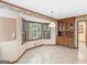 Cozy breakfast nook with large windows and custom built-ins for storage and display at 25 Ridgeview Dr, Jonesboro, GA 30236