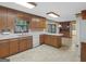 Traditional kitchen featuring wooden cabinets, white appliances, and ample counter space at 25 Ridgeview Dr, Jonesboro, GA 30236