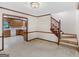 Inviting living room featuring a wood staircase with a view into the traditional kitchen at 25 Ridgeview Dr, Jonesboro, GA 30236