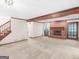 Bright, open living room with a brick fireplace, staircase and access to other rooms at 25 Ridgeview Dr, Jonesboro, GA 30236