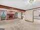 Open living room featuring a brick fireplace and large windows with plenty of natural light at 25 Ridgeview Dr, Jonesboro, GA 30236