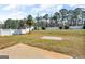 Large backyard featuring a lush green lawn with a white fence at 362 Interlake Pass, Mcdonough, GA 30252