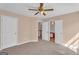 This bedroom includes a ceiling fan and has convenient access to the bathroom at 362 Interlake Pass, Mcdonough, GA 30252