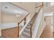 Welcoming two-story foyer featuring hardwood floors and an elegant staircase at 362 Interlake Pass, Mcdonough, GA 30252