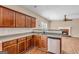 Kitchen area with wooden cabinets, stainless steel appliances, and hardwood floors at 362 Interlake Pass, Mcdonough, GA 30252