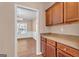 Beautiful kitchen cabinets with stainless appliances gives way to a light filled dining room at 362 Interlake Pass, Mcdonough, GA 30252
