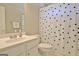 Bathroom sink and toilet area with polka dot shower curtain at 155 Westminister Village Blvd, Sharpsburg, GA 30277