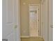 View of a bathroom featuring a polka dot shower curtain and white sink from a hallway entrance at 155 Westminister Village Blvd, Sharpsburg, GA 30277
