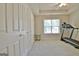 Bedroom features a window, treadmill and neutral colors at 155 Westminister Village Blvd, Sharpsburg, GA 30277