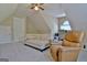 Bonus room featuring neutral carpet, a daybed, a recliner and unique architectural features at 155 Westminister Village Blvd, Sharpsburg, GA 30277