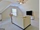 Bonus room featuring a sofa, TV, a window, and neutral carpeting at 155 Westminister Village Blvd, Sharpsburg, GA 30277
