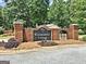 Classic brick entrance to Westminster Village with manicured landscaping, welcomes residents and guests at 155 Westminister Village Blvd, Sharpsburg, GA 30277