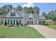Charming two-story home with well-manicured lawn and inviting curb appeal at 155 Westminister Village Blvd, Sharpsburg, GA 30277