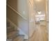 Hallway with wood floors leads to a dining area and kitchen at 155 Westminister Village Blvd, Sharpsburg, GA 30277
