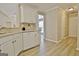 Kitchen featuring white cabinets, stainless steel appliances, and neutral countertops at 155 Westminister Village Blvd, Sharpsburg, GA 30277