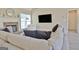 Comfortable living room space featuring a fireplace, a large TV, and modern flooring at 155 Westminister Village Blvd, Sharpsburg, GA 30277
