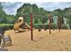 Outdoor playground with swings and slides for Gathering fun; this community offers many great recreational spaces at 155 Westminister Village Blvd, Sharpsburg, GA 30277