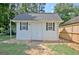 Outdoor shed on a well-maintained property with mature trees at 155 Westminister Village Blvd, Sharpsburg, GA 30277