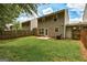 Backyard showing a well-maintained lawn, concrete patio, wood fence, and siding at 134 Watercress Ct, Stockbridge, GA 30281