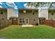 Backyard featuring a well-kept lawn, wood fence, patio, and siding at 134 Watercress Ct, Stockbridge, GA 30281
