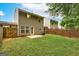 Backyard view featuring well-maintained lawn, patio, and wood fence with siding at 134 Watercress Ct, Stockbridge, GA 30281