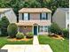 Charming two-story home features a well-maintained lawn, green shutters, and a welcoming front entrance at 134 Watercress Ct, Stockbridge, GA 30281