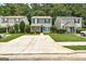Charming home with manicured lawn, concrete driveway, and green shutters at 134 Watercress Ct, Stockbridge, GA 30281