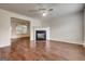 Bright living room boasts hardwood floors, a fireplace, and plenty of natural light at 134 Watercress Ct, Stockbridge, GA 30281