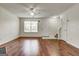 Bright living room featuring hardwood floors, neutral paint, and a ceiling fan at 134 Watercress Ct, Stockbridge, GA 30281