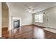 Cozy living room with a fireplace, hardwood floors, and natural light at 134 Watercress Ct, Stockbridge, GA 30281
