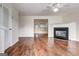Bright living room boasts hardwood floors, a fireplace, and plenty of natural light at 134 Watercress Ct, Stockbridge, GA 30281