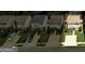 Street view of a row of homes showcasing driveways and manicured lawns at 134 Watercress Ct, Stockbridge, GA 30281