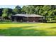 Manicured backyard with grass and patio at 1527 Patricia Dr, Morrow, GA 30260
