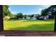 View of expansive backyard with grass, and storage buildings at 1527 Patricia Dr, Morrow, GA 30260