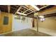 Spacious unfinished basement with exposed ceiling, small window and concrete floor at 1527 Patricia Dr, Morrow, GA 30260