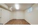 The basement boasts wood-look flooring, bright lighting, and ample storage for a functional and inviting space at 1527 Patricia Dr, Morrow, GA 30260