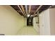 Basement hallway features bright lighting and storage, enhancing usability and organization at 1527 Patricia Dr, Morrow, GA 30260