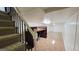 A staircase provides access to the basement, which features an open living space with a built-in desk and storage at 1527 Patricia Dr, Morrow, GA 30260