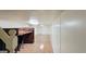 Basement area featuring a functional built-in desk and storage combination with an adjacent open living space at 1527 Patricia Dr, Morrow, GA 30260