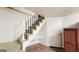 Stairs with convenient shelving create an organized and functional area in the basement at 1527 Patricia Dr, Morrow, GA 30260