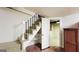 Basement stairs with shelving offer easy access and added storage beneath at 1527 Patricia Dr, Morrow, GA 30260
