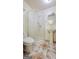 Bathroom featuring a glass shower enclosure, patterned tile floor and a pedestal sink at 1527 Patricia Dr, Morrow, GA 30260