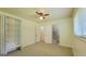 Bedroom with ceiling fan, 2 closets, and bathroom access at 1527 Patricia Dr, Morrow, GA 30260