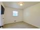 Bedroom with a large window, carpet, and neutral colored walls at 1527 Patricia Dr, Morrow, GA 30260