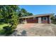 Brick house exterior with driveway, beautiful landscaping, and a welcoming entrance at 1527 Patricia Dr, Morrow, GA 30260