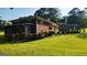 Two-story brick house featuring a well-manicured lawn and mature landscaping for outdoor enjoyment at 1527 Patricia Dr, Morrow, GA 30260