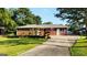 Traditional brick home with an extended driveway and professionally landscaped front yard at 1527 Patricia Dr, Morrow, GA 30260