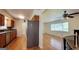 Open view of the kitchen that leads to the dining area and living room, blending the spaces seamlessly at 1527 Patricia Dr, Morrow, GA 30260