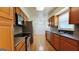 Bright kitchen with stainless steel appliances, hardwood floors, and adjacent dining area at 1527 Patricia Dr, Morrow, GA 30260